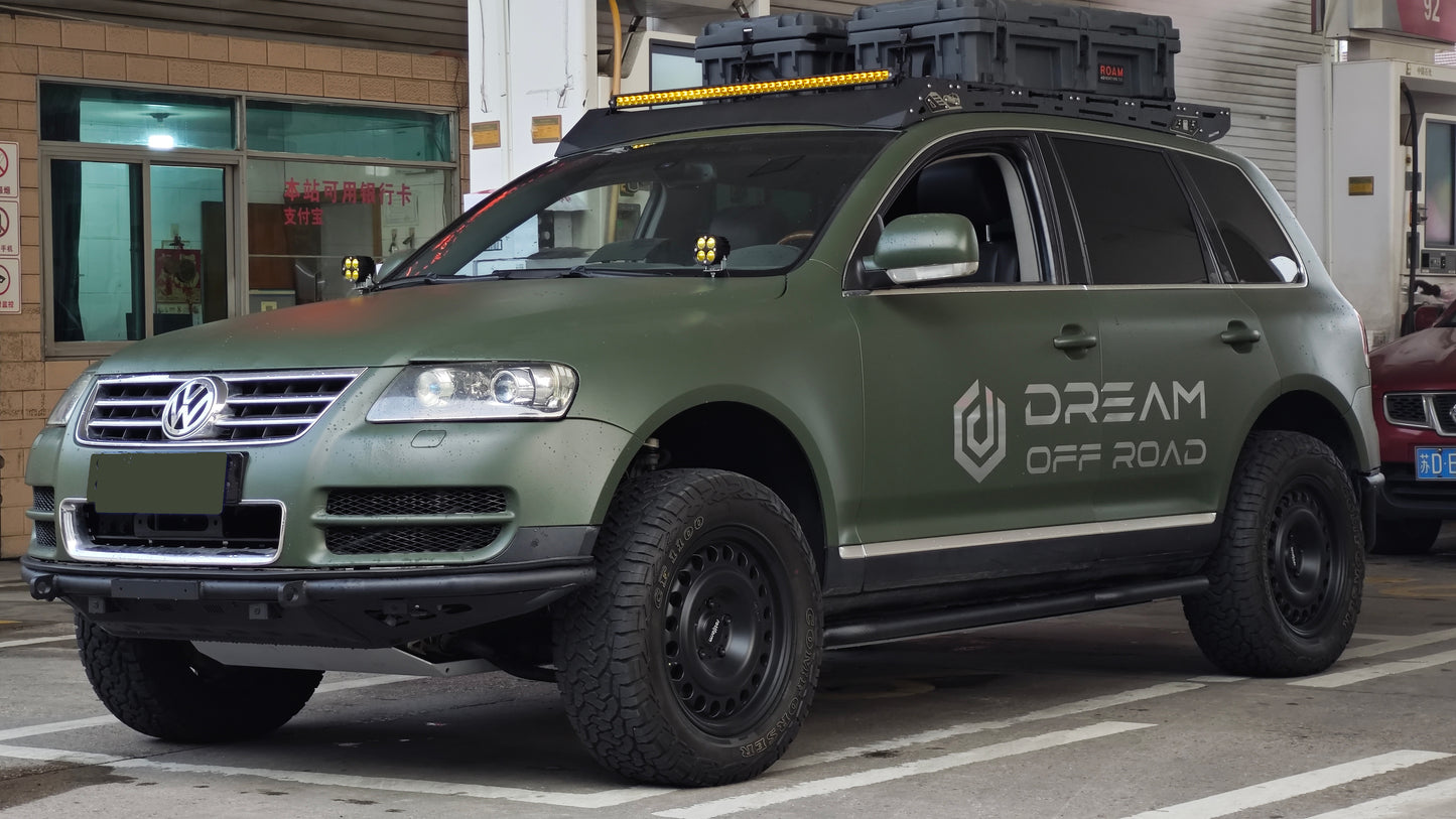 VW Touareg Gen 1 off-road front bumper (2002–2010) — trail action shot on lifted Touareg