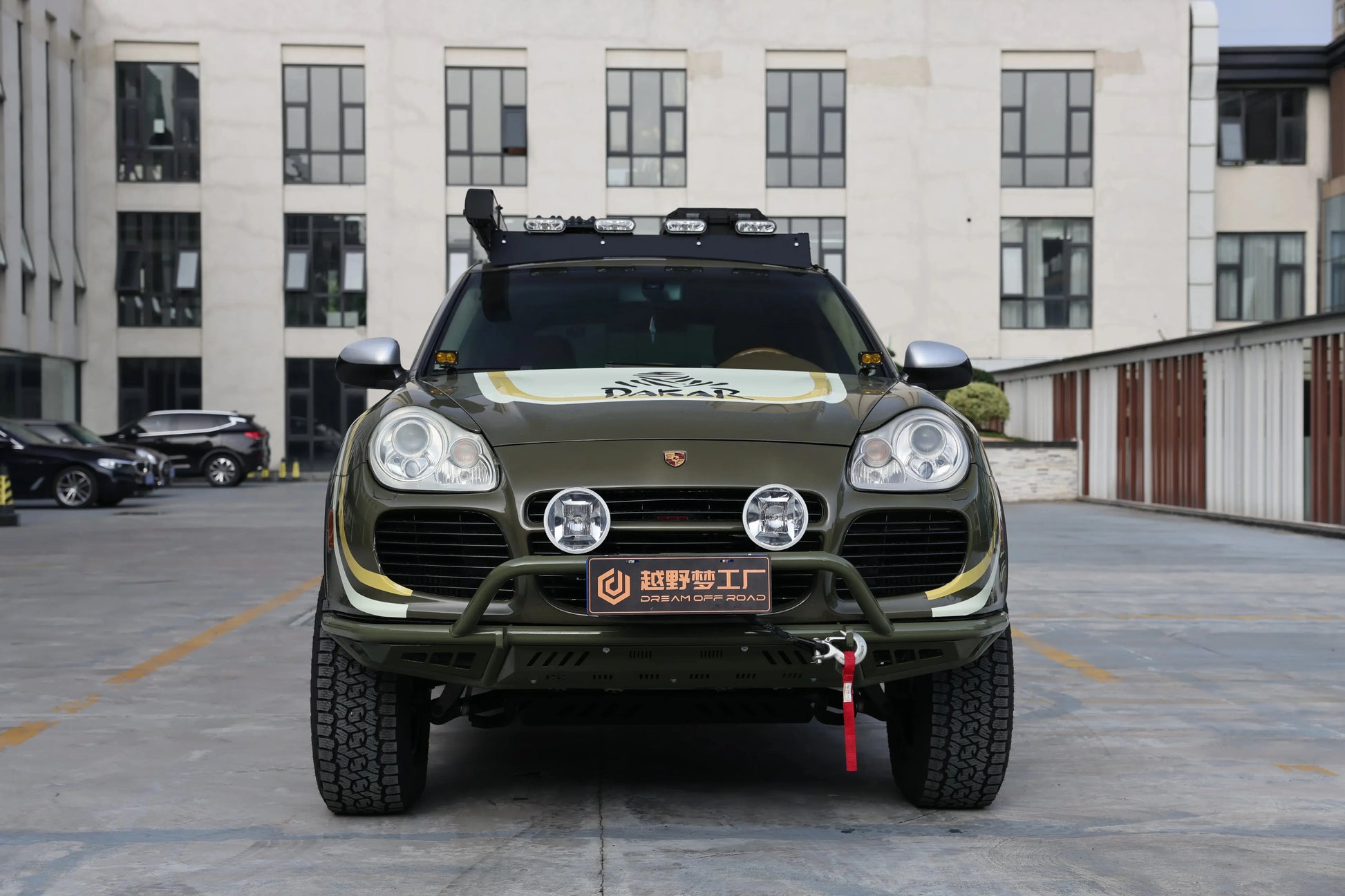 Porsche Cayenne 955 off-road front bumper (2002–2007) — trail action shot on lifted Cayenne