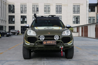 Porsche Cayenne 955 off-road front bumper (2002–2007) — trail action shot on lifted Cayenne