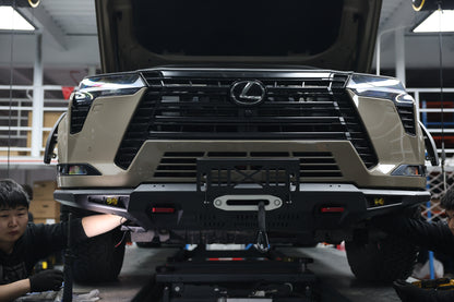 Lexus GX550 off-road front bumper — grille and skid plate detail