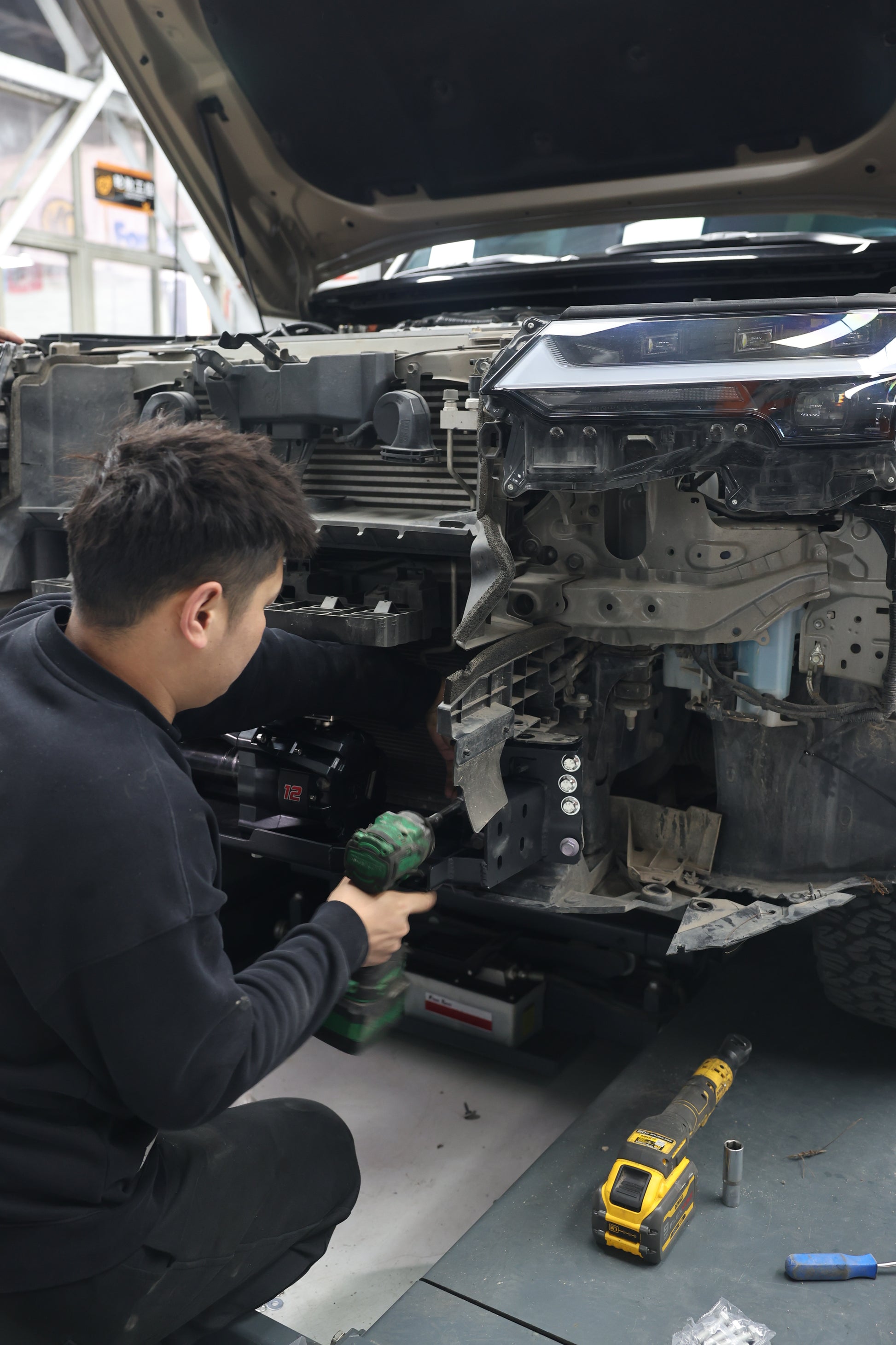 Lexus GX550 off-road front bumper — underside mounting bracket view